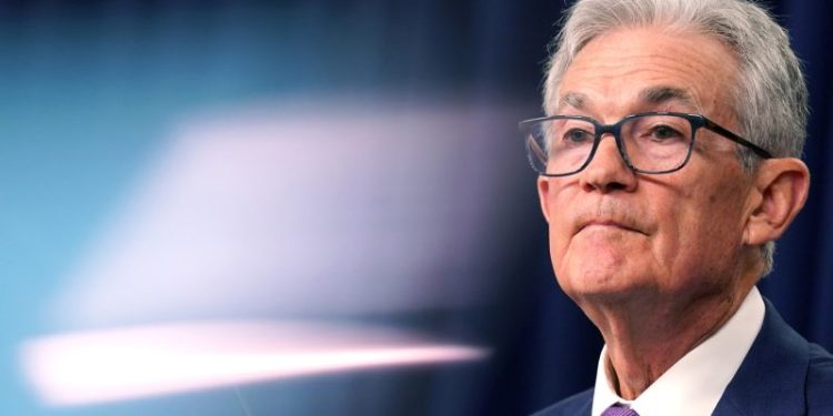 Fed holds interest rates but keeps door open to a cut in coming months