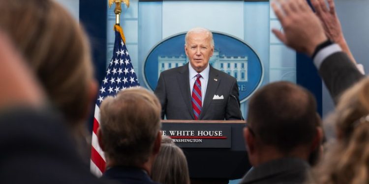 In surprise visit with reporters, Biden shares concerns about election violence